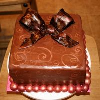 Chocolate And Gold Cake My seconf attempt at a gumpaste bow... Gold luster dust painte onto chocolate fondant.