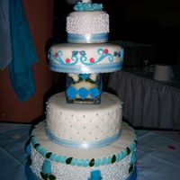 My 1St Wedding Cake A four tier chocolate cake covered with marzipan & fondant. I sculpted the rosebuds in the first layer to create depth. This cake...