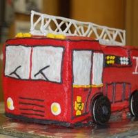 Firetruck Chocolate Cake, BC icing, Color flow ladder, Orea wheels. The little boy was turning 3, thus the number 3.