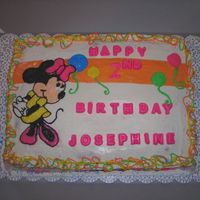 Minnie Mouse This is done with BC icing and is a vanilla cake. It is somewhat copied from an invatation I was given. The letters are chocolate.