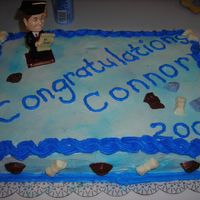 Grad Cake #2 This cake is all white and I coloured chocolates for this one as well.The blue was his school colours.