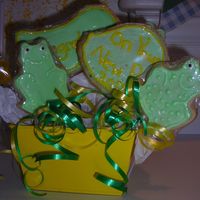 Frog Cookies Came up with this,THANKS for all your HElp CC Members! Theres more frogs in the back and the lily pads say Congrats.....On your New Pad...