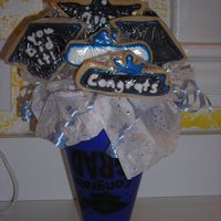 Graduation Cookie Bouquet I did this for our neighbour and blue & white are her school colours. They are sugar cookies with royal icing. Should I be using the...
