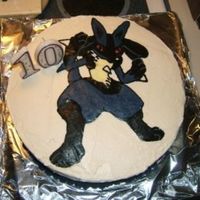 Lucario Birthday cake done for my little sister last year. It is chocolate cake with vanilla buttercream and a buttercream transfer.