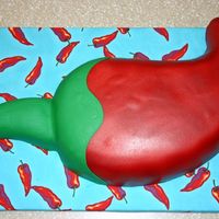 Chili Pepper Chili pepper for chili cookoff. Used big sheet cake and cut the shape. The stem was a different piece. Chili was covered in white fondant...