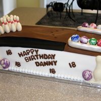 Bowling Cake made for my 18 year-old nephew's birthday. This was my first attempt at those candy mold things....the pins were candy as were...