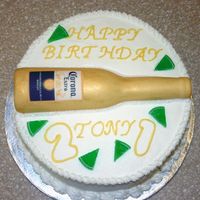 21St Birthday Cake - Corona Corona Bottle. Not particularily thrilled with the cake. The bottle is a gumpaste/fondant mixture that was laid over a corona bottle. The...