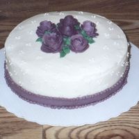 Mother's Day Single 9" layer in buttercream, for my mom and sister. 1st attempt at a frosting ribbon and beads. Still in my 1st year and my...