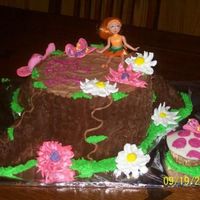 Whimsical Fairy Tree This was a very easy cake for my 7 year old daughter's birthday. I baked 4 standard round cakes, stacked 3 and the fourth I cut into 1...