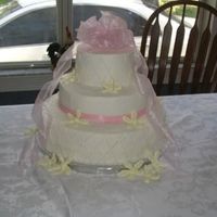 Simple Elegant This is the first wedding cake I ever made. It was a great choice because it wasn't too difficult. The pearls on the side of the cake...