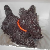 Scottish Terrier I used the stand up lamb for the base and added the nose, ears and tail. Iced in buttercream with grass tip - lots of black!