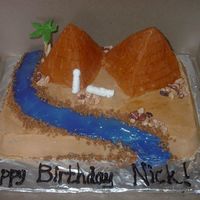 Pyramids And Mummies buttercream with mmf accents, piping gel water , for my son's 7th birthday.