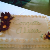 Purple Water Lillies this is a half sheet cake frosted in buttercream. The flowers are made of choco clay