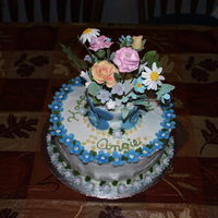 Flower Vase The flowers are made of gum paste and I used regular artificial flower stems. I ment to put chocolate cookie crumbs for the dirt but forgot...