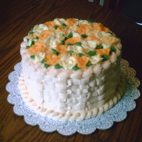 Basket Of Flowers 8 inch round frosted with buttercream. Flowers are all hand made with buttercream