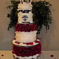 Red Rose Black Stencil This was a very large cake but a customer request...Red Rose (real in between the tiers) then with black decorations.