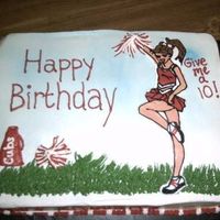 Cheerleader Cake This was the biggest cake I have ever done. It was a 11x15 double layered. The cheerleader was a BCT and everything else was free-handed....