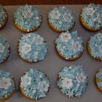 Bridal Shower Cupcakes These cupcakes were made for a cupcake tree placed at a bridal shower. The flowers are made of fondant.