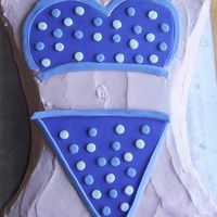 Purple Bikini Cake I made this in a 32 Degree kitchen with icing melting.. it was touch and go for a bit! Golden Cake with vanilla creme in the centre.