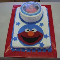 Elmo Sheet cake with Elmo face made out of fondant.
