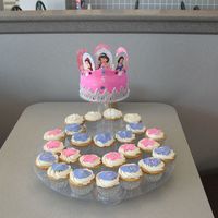 Fondant Princess Crown And Cupcakes B-day 6inch cake with Fondant crown and fondant accents on the cupcakes.