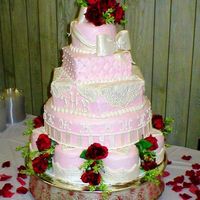 Valentine's Day Romantic Wedding The pink icing is smooth butter cream with pearlized fondant accents.