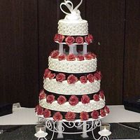 First Wedding Cake With Tiers This wedding cake is my first 4 layer tiered cake. All 71 roses are made of fondant.
