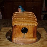 Birdhouse With Bluebird This is birdhouse cake with a little bluebird sitting on top bluebird is sculpted out of candy clay, and the rest is covered in fondant.