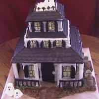 Haunted House Chocolate cake, cookies n cream filling. Roof made of chocolate, rails and post made from sugarpaste. Cake was made for a little girls 12th...