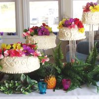 Tropical Themed Wedding 4-tiered cake on separate acrylic stand for a casual tropical beach wedding