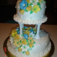 Course Iii Final Cake White cake with buttercream frosting, and royal icing for flowers, except the yellow fondant roses and leaves.