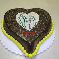 Chocolate Cake Frosted With Choc Bc/ganache This is a chocolate cake frosted with choc BC then layered with two coats of ganache. Topped off with a choc heart covered with a choc...
