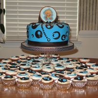 Modern Baby Boy 8 inch round cake with lots of cupcakes.