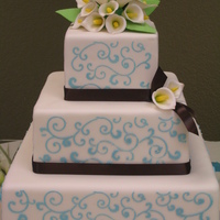 Ashley 6 x 10 chocolate with choc bavarian cream; 14" vanilla with cheesecake bavarian; royal icing stenciling; gumpaste calla lilies