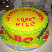 Grandsons Dual birthday cake for grandsons, age 2 and 3. Chocolate sour cream, 10". Fondant cutouts. Forgot to take a picture with the candles...