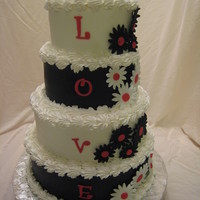 Black And White Daisys 5 x 7 x 9 x 11; 5 & 9 are vanilla cake, 7 and 11 are chocolate sour cream. AIrbrushed black; fondant daisys and lettering