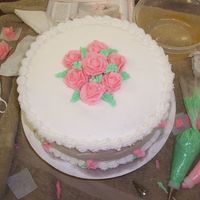 Final Cake Wilton Course 1 The cake turned out okay since it broke and fell into tiny pieces. I had to glue it together. Also, I need to work on my shells!