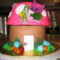 Mushroom Cake This is a vanilla cake with chocolate buttercream filling and icing. The top is covered in fondant with fondant accents. The fairy is based...