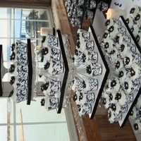 Black & White Damask Cupcake Wedding Tower Black & White Damask cupcake wrappers with daisy flowers on tower built from crystal cake pedestals.