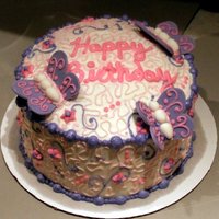 Butterfly Birthday Cake Three layered checkered cake, decorated with Buttercream icing. Butterflies are fondant.