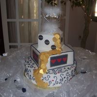 Vegas Wedding I unique cake for a couple that got married in vegas. Iced in buttercream with fondant coins and accents. Although they are hard to see,...