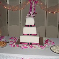 Pink & Black Monogram This was my first wedding cake and for my brother. I had trouble with my fondant. Bottom layers are styrofoam and the top was raspberry...