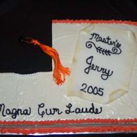 Jerry's Graduation Another one from the beginning when my husband got his masters. Freehand piping was horrible...and hasn't improved much. This is a red...