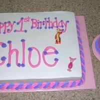 Pooh Birthday Cakes My niece's 1st Birthday cakes. Large cake has pooh figurines and the smash cake has a FBCT.