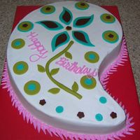 Paisley I used the large Wilton Paisley cake pan for this cake. Covered in buttercream and the decorations are fondant.