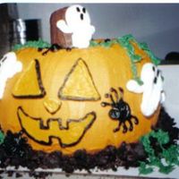 3-D Jack-O-Lantern I copied this idea from a magizine photo using a bunt pan.Everything is edible...Ice crean cone stem...Oreo cookie dirt...It was a big hit...