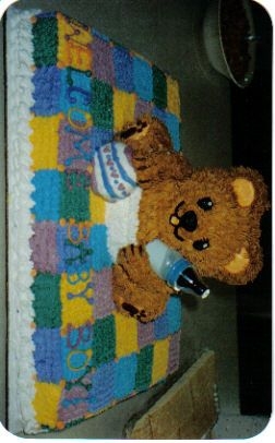 Baby Bear On A Blankie I made this cake for a good friends baby shower using a half sheet pan and Wiltons 3-d bear pan.