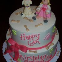 Puppy Party TIERED CAKE WITH B.C. ICING AND FONDANT CHARACTERS, BONES AND BOW. THIS WAS FOR A LITTLE GIRLS 6TH BIRTHDAY WITH A PUPPY THEME.