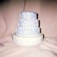 Curtis & Selena's Anniversary Cake Chocolate Cake with Raspberry Kahlua filling and buttercream icing. Lavender with white cornelli. They loved it very much!