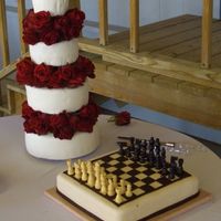 Chris & Nina's Wedding Cake My first official wedding cake and first time to do such a large cake with Fondant. They wanted complete smooth flush 4 tiers with red...